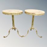 A pair of decorative gilt and onyx pedestal wine tables.