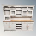 A painted pine traditional style dresser, width 250 cm x height 207 cm.