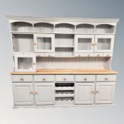 A painted pine traditional style dresser, width 250 cm x height 207 cm.