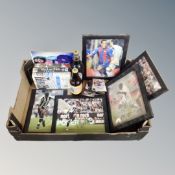 A box containing signed football photographs,