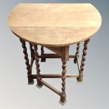 A 20th century flap sided gate leg table.