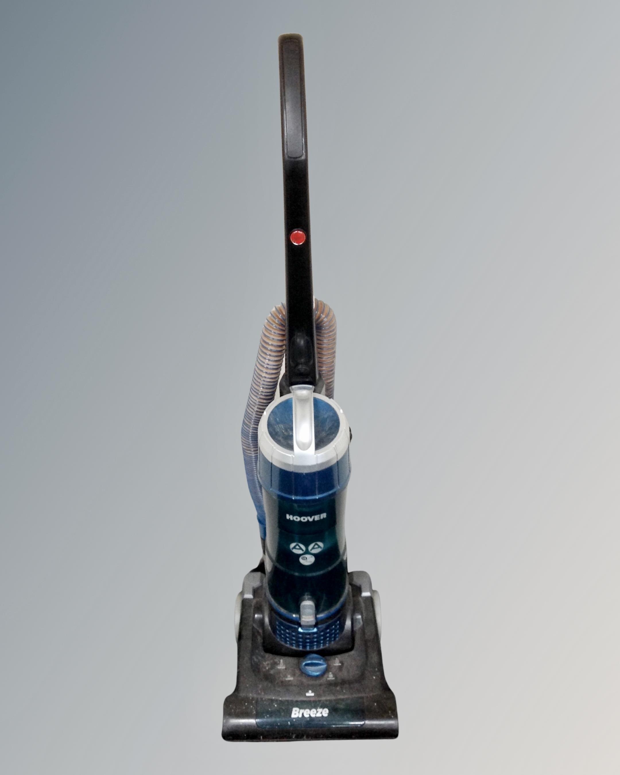 A Hoover Breeze upright vacuum.