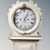 A Scandinavian painted longcase clock with circular dial, pendulum and weights.