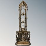 A Victorian style ornate cast iron hall stand.