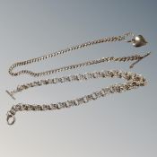 A sterling silver fancy link necklace together with a further white metal necklace with heart