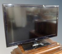 An LG model 42LE4500 LCD TV with lead and remote.