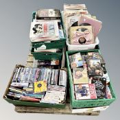 A pallet containing 10 boxes of assorted DVDs, CDs, early 20th century 78 records and vinyl LPs.