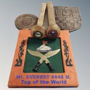 A collection of commemorative items including Mount Everest Top of the World badge,