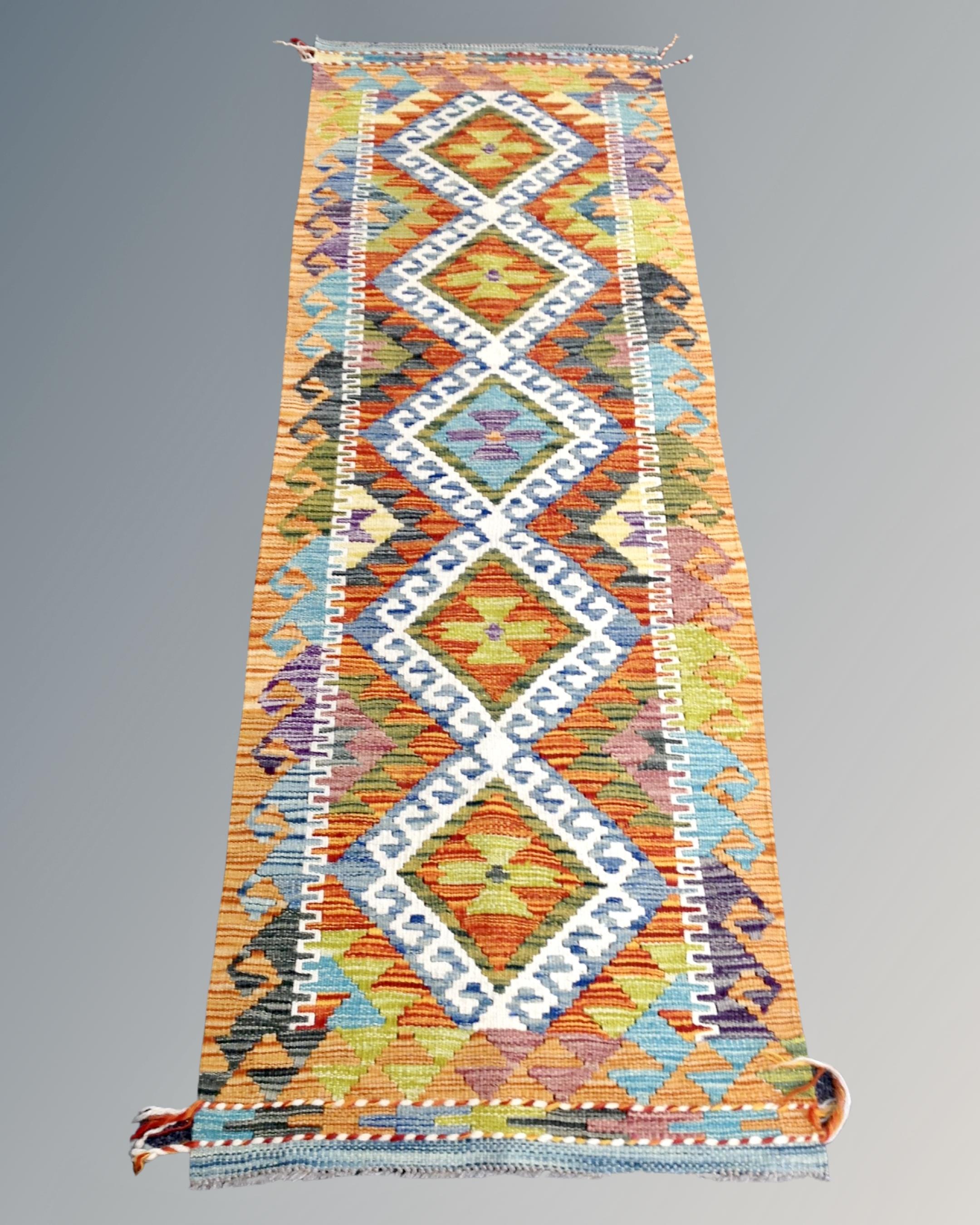 A Chobi kilim runner 180cm by 60cm