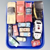 A tray containing mid-20th century tin plate and plastic vehicles including wind up example.