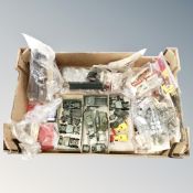 A box containing a quantity of vintage plastic modelling kits and buildings including Airfix.