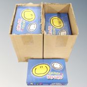 Ten boxes of Smiley key caps, sealed and new.