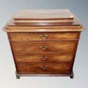 A 19th century Scandinvian four drawer chest on scroll feet with caddy top