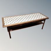 A mid-20th century Danish rectangular tile topped coffee table with undershelf.