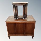 A 20th century oak panelled blanket box together with a nest of three tables.