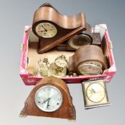 A box containing early 20th century and later mantel clocks.