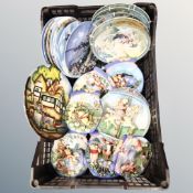 A crate containing Bradex Winnie the Pooh collectors plates together with further collectors plates