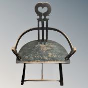 A 19th century primitive armchair with heart-shaped backrest