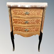 A French Louis XV style marble topped three drawer chest on raised legs.