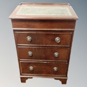 A Victorian style davenport fitted with three drawers beneath.