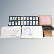 A tray containing a cigarette card album, autograph book, trinket box, dominoes etc.
