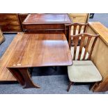 A 20th century G plan drop leaf table together with a pair of rail back chairs in a mahogany finish.