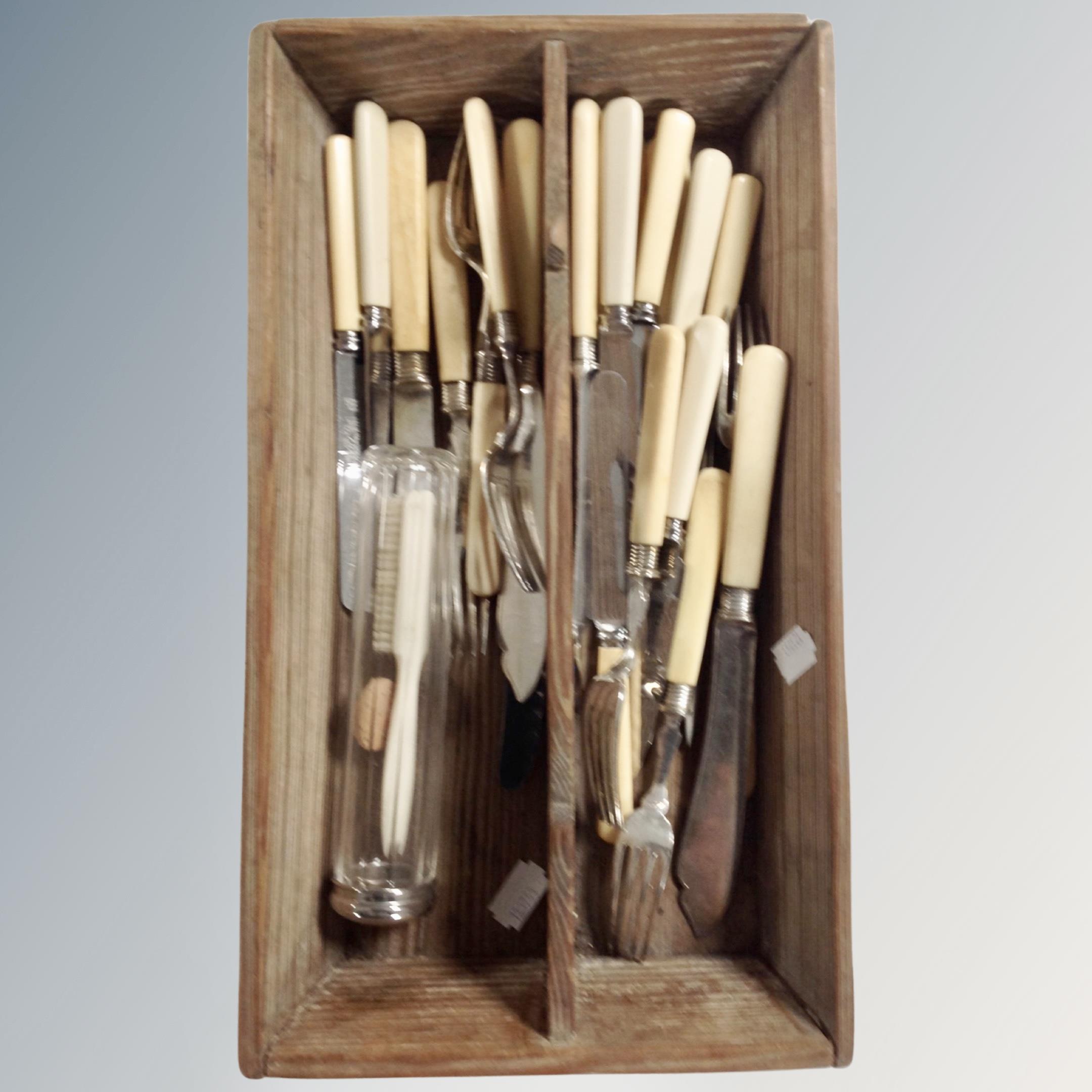 A wooden cutlery trough containing cutlery together with a box containing a quantity of vintage