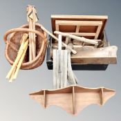 A box and a vintage wicker basket containing wooden pieces including a music stand, folding stools,