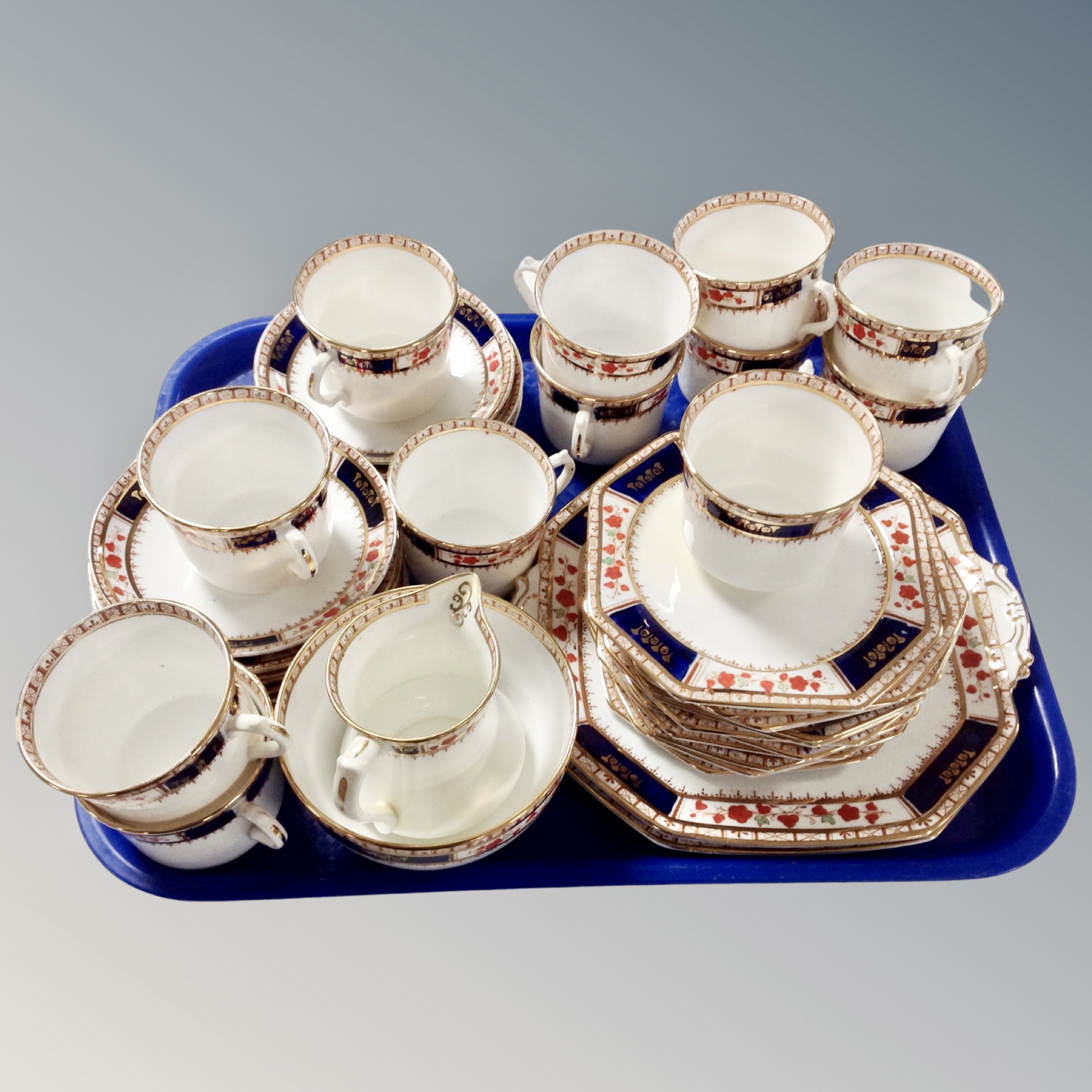 A tray containing a Staffordshire English tea set.