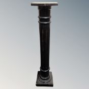 An early 20th century ebonised plant pedestal.