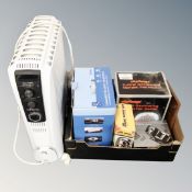 An oil filled Delonghi radiator together with a box containing an oscillating fan,