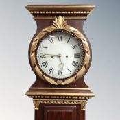 A Scandinavian painted longcase clock with circular dial, pendulum and weights.