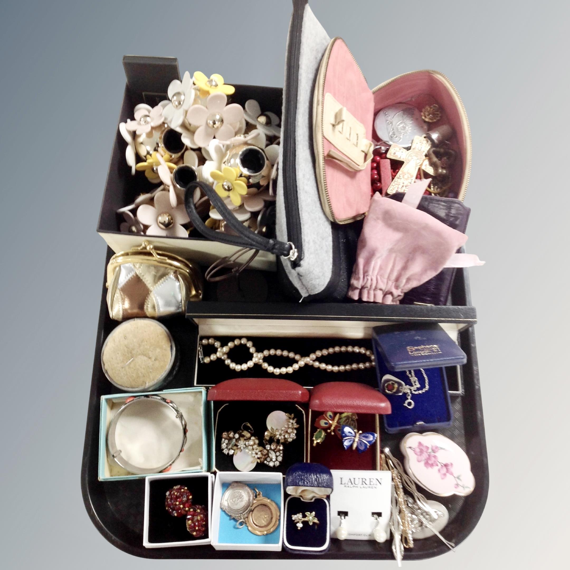 A tray containing costume jewellery including brooches, necklaces etc.
