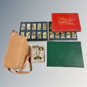 Two albums containing cigarette cards, together with a small box containing cigarette cards,