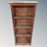 A set of 20th century stained pine open bookshelves.