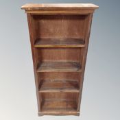 A set of 20th century stained pine open bookshelves.