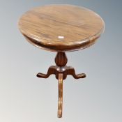 A Victorian style circular coffee table on three way pedestal.