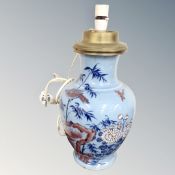 A Chinese blue glazed porcelain vase converted to a table lamp.
