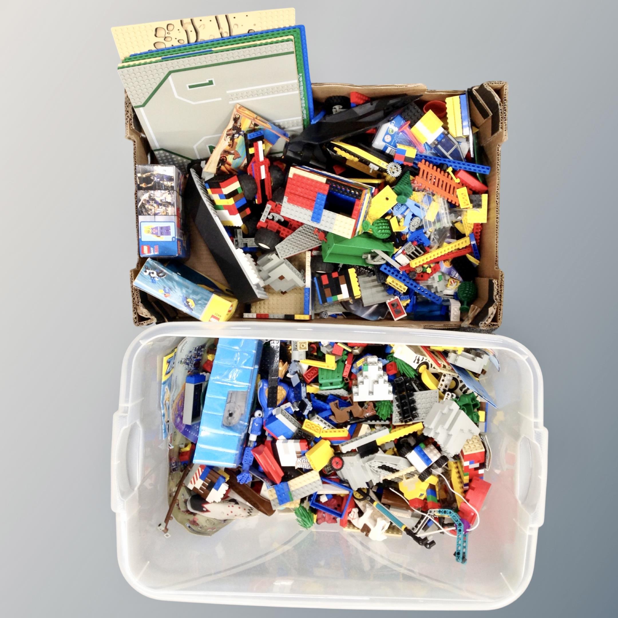 Two boxes containing an assortment of Lego.