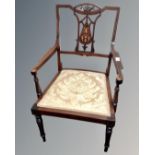 An Edwardian inlaid mahogany open armchair