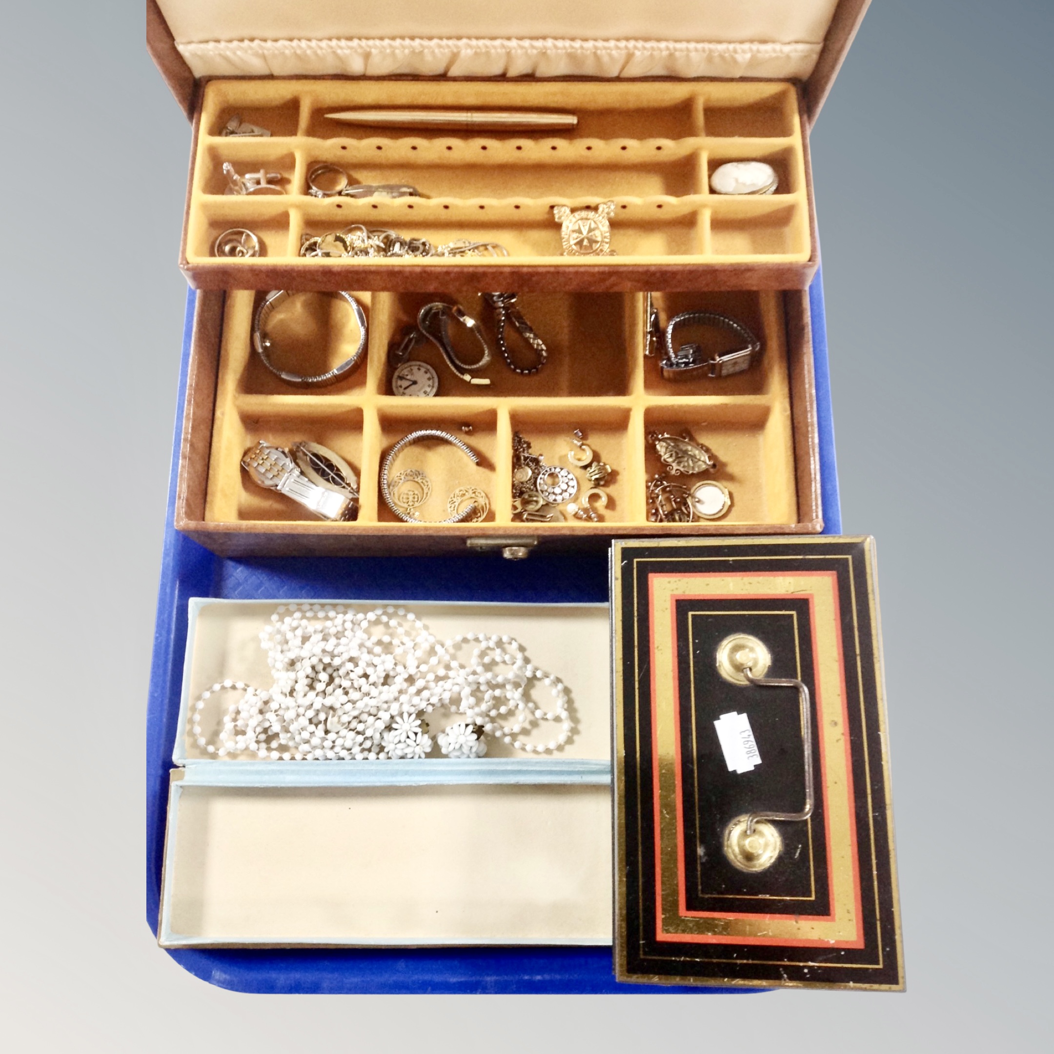 A jewellery box and a tin containing costume jewellery, wristwatches, a vintage brooch, cufflinks,