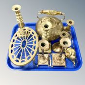 A tray of brass including candlesticks, a trivet stand, kettle, fish ornament etc.