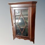 An Edwardian inlaid mahogany corner wall cabinet.