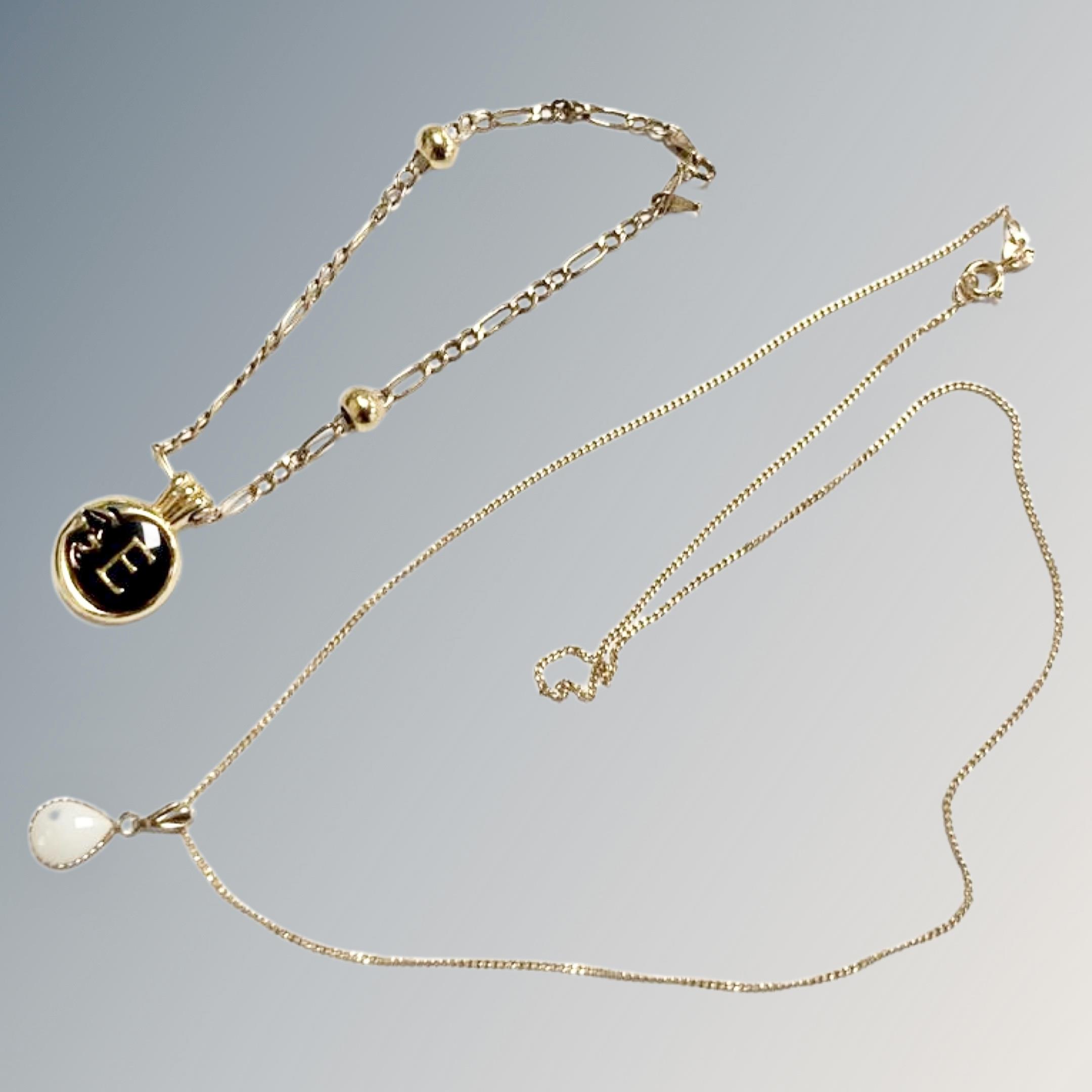 A 9ct yellow gold necklace with white opal pendant together with a further 9ct gold bracelet with