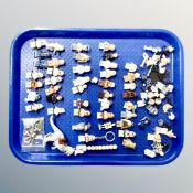 A tray containing a quantity of Lego Star Wars minifigures and accessories.