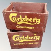 Two wooden hand painted Carlsberg crates.