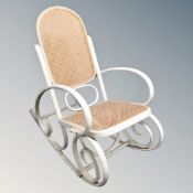 A Michael Thonet-design painted bentwood and bergere rocking chair.