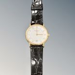 A Raymond Weil 18ct gold plated Gentleman's wrist watch on black leather strap.