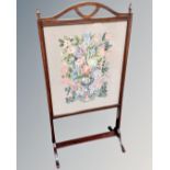 A late 19th century stained beech tapestry fire screen