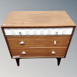 A mid-century three drawer chest.